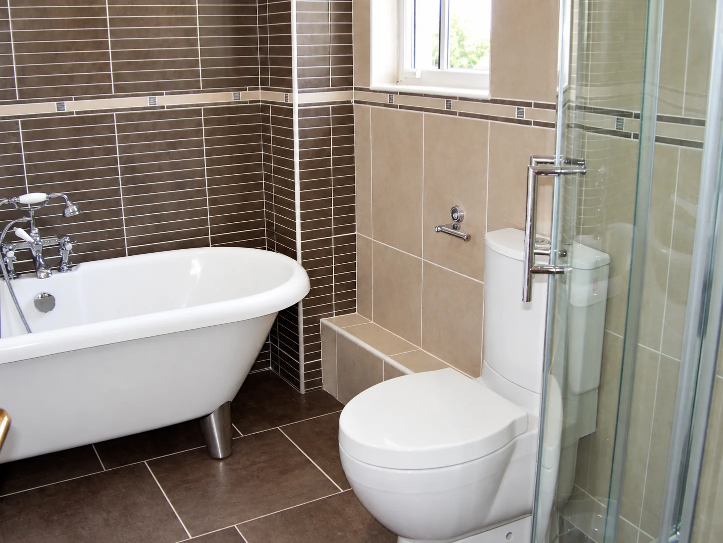 Bathroom with freestanding bath and coordinated tiling